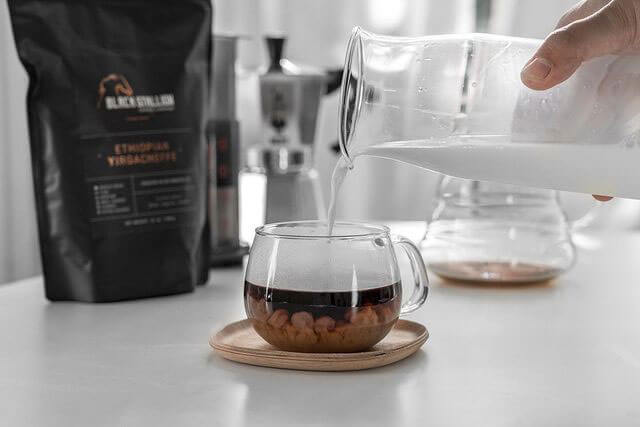 Specialty coffee from Black Stallion Coffee named Ethiopian Yirgacheffe in a cup. Premium quality coffee being perfectly mixed with cream to create a smotth creamy coffee taste.   