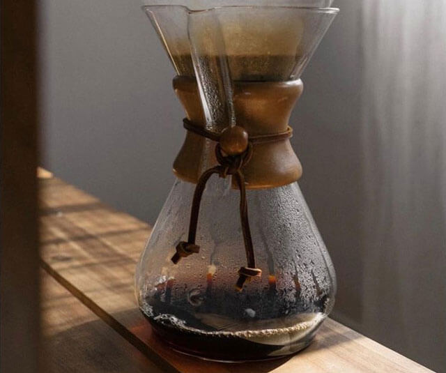 Chemex  filled with premium grade coffee Colombian Huila Supremo during the coffee drip process. Coffee roasted by roast masters that specialize in coffee roast in San Gabriel.  